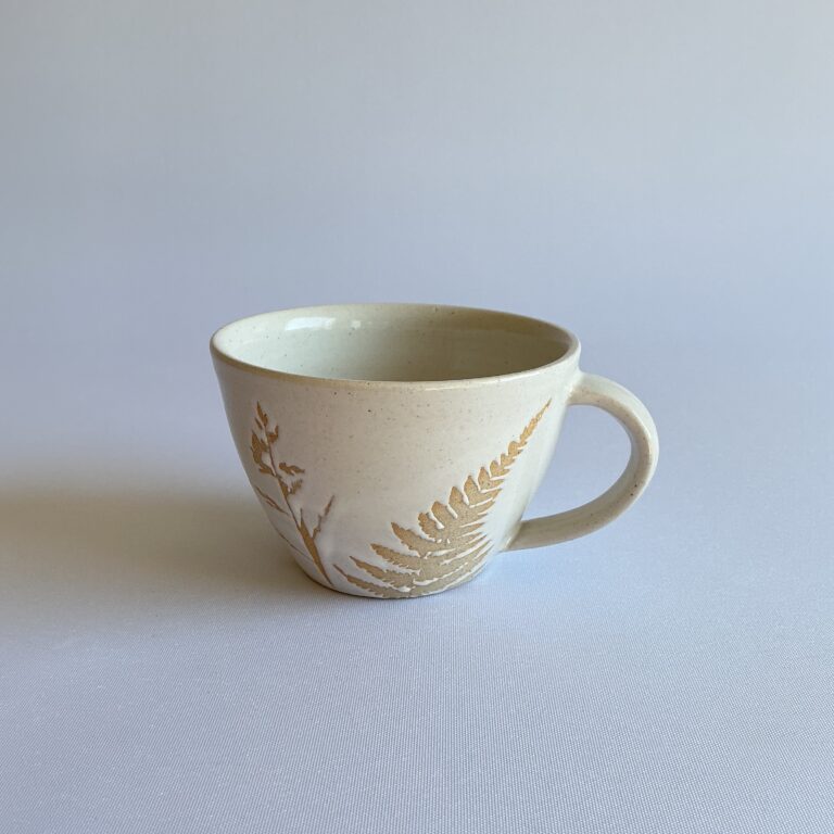 Stoneware cup with hedgerow design