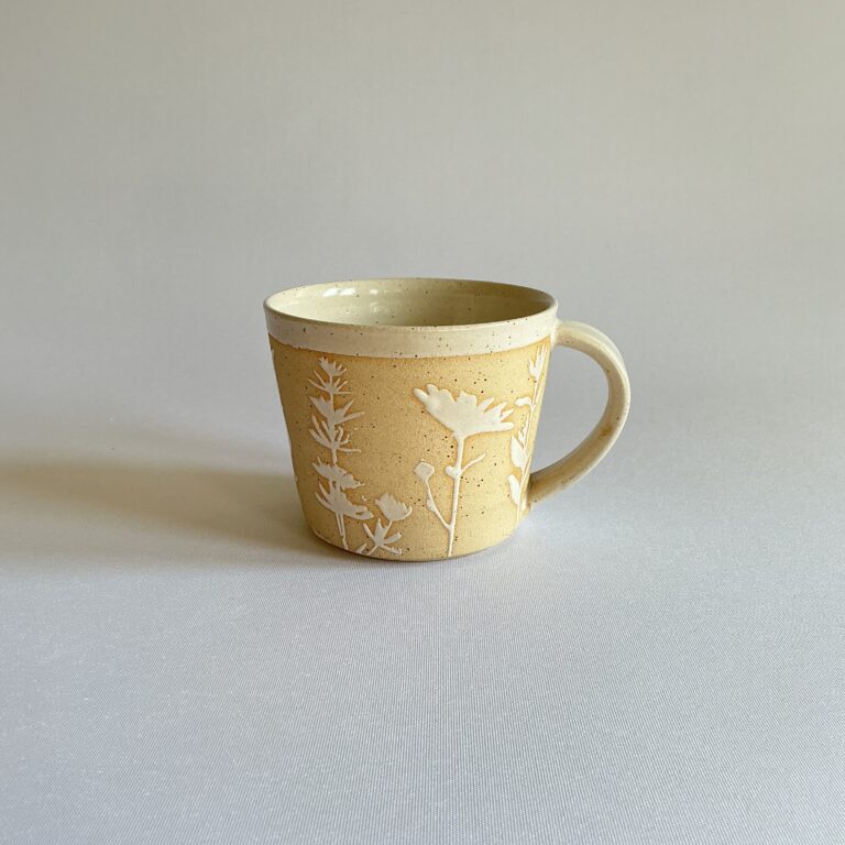 Stoneware cup with botanical design