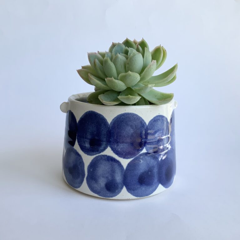 Planter with large indigo spot