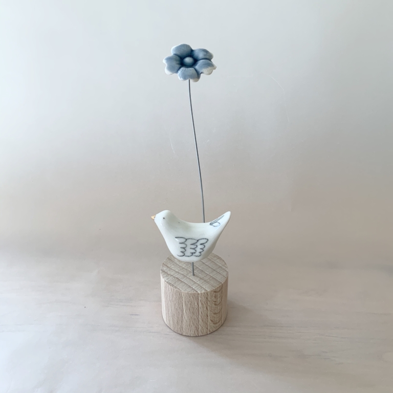 Single bird with flower detail