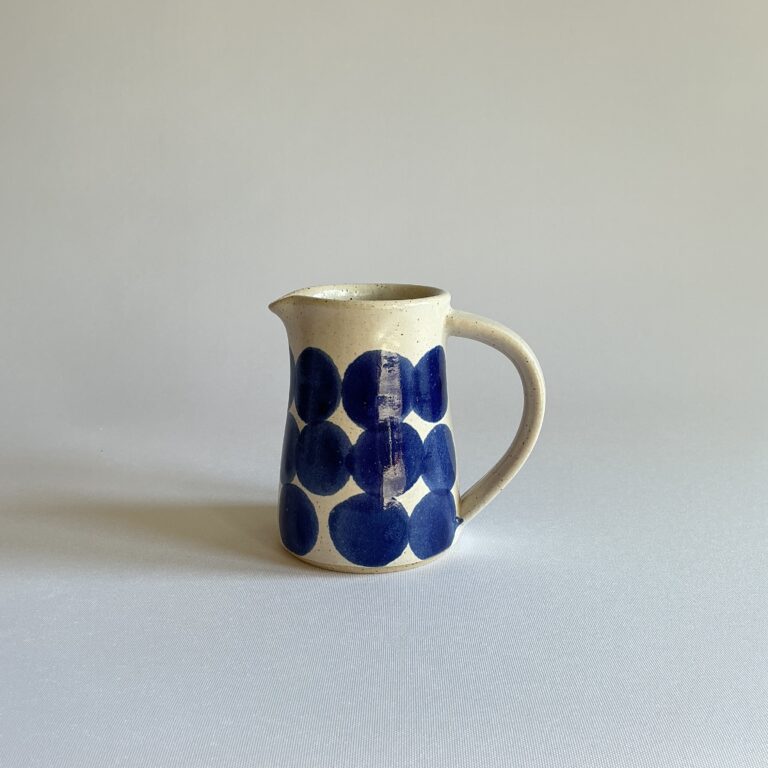 Small Jug with white opaque glaze and decorated with large indigo spot