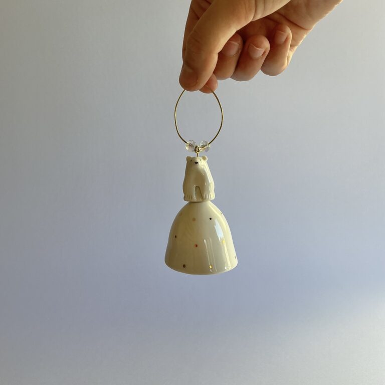Christmas tree bell, porcelain with gold spot design and topped with a handmade Polar Bear.